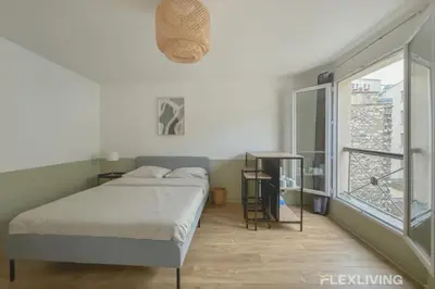 Un ou plusieurs lits dans un hébergement de l'établissement Flexliving - Studio - Echiquier
