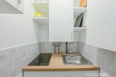 Cuisine ou kitchenette dans l'établissement Flexliving - Studio - Jarente