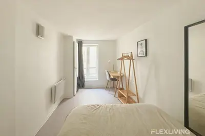 Un ou plusieurs lits dans un hébergement de l'établissement Flexliving - Onebedroom - Hopital