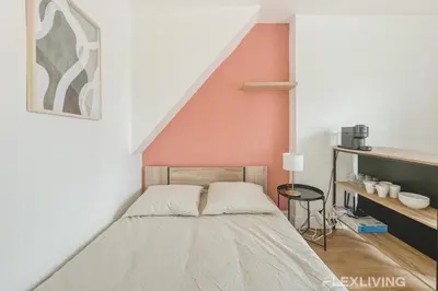 Un ou plusieurs lits dans un hébergement de l'établissement Studio cosy à Neuilly Ligne 1 à 5min & La Défense