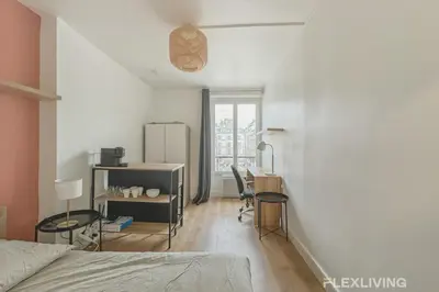 Un ou plusieurs lits dans un hébergement de l'établissement Studio cosy à Neuilly Ligne 1 à 5min & La Défense