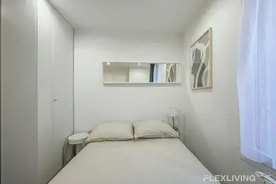 Un ou plusieurs lits dans un hébergement de l'établissement Flexliving - Studio - Bauches