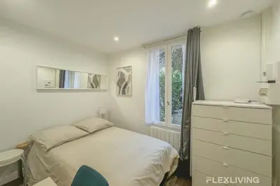 Un ou plusieurs lits dans un hébergement de l'établissement Flexliving - Studio - Bauches