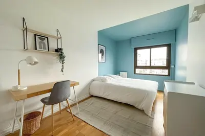 Un ou plusieurs lits dans un hébergement de l'établissement Flexliving - room - Hillairet