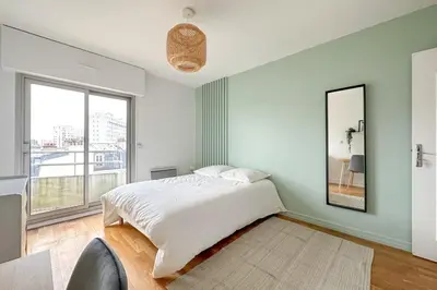 Un ou plusieurs lits dans un hébergement de l'établissement Flexliving - room - HIllairet