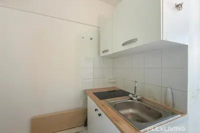 Cuisine ou kitchenette dans l'établissement Flexliving - Lovely studio near Jardin des Plantes