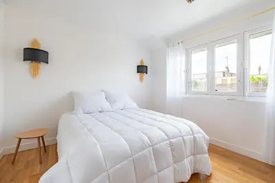 Un ou plusieurs lits dans un hébergement de l'établissement Appartement 75017 proche Champs Elysées