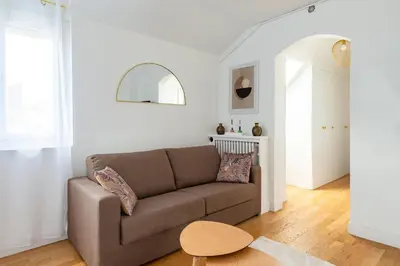 Coin salon dans l'établissement Appartement 75017 proche Champs Elysées