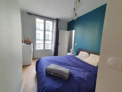 Un ou plusieurs lits dans un hébergement de l'établissement Saint-Honore - Luxury apartment 1 BR