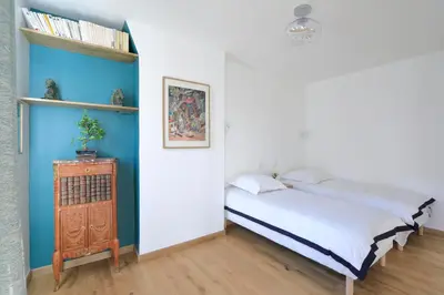Un ou plusieurs lits dans un hébergement de l'établissement Appartement Triplex refait à neuf à Bastille