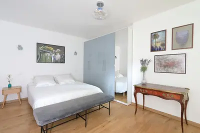 Un ou plusieurs lits dans un hébergement de l'établissement Appartement Triplex refait à neuf à Bastille