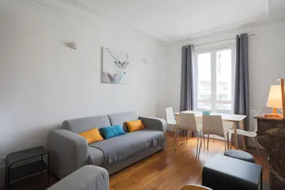 Coin salon dans l'établissement Superbe appartement familial au cœur du 14 eme