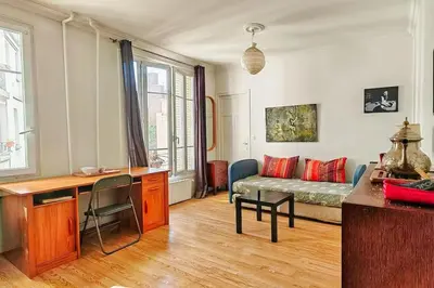 Coin salon dans l'établissement Charmant Appartement près de Montmartre