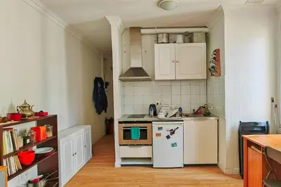Cuisine ou kitchenette dans l'établissement Charmant Appartement près de Montmartre