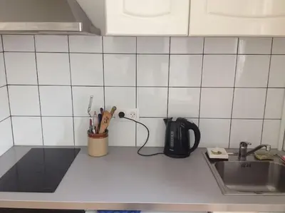 Cuisine ou kitchenette dans l'établissement Charmant Appartement près de Montmartre