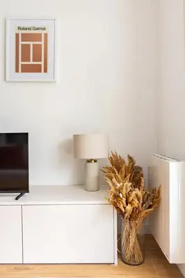 Télévision ou salle de divertissement dans l'établissement Appartement cosy avec terrasse proche de Paris