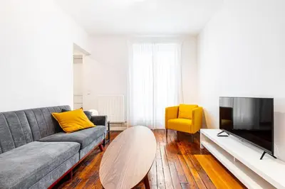 Coin salon dans l'établissement GuestReady - Appartement Confortable dans le 10e.