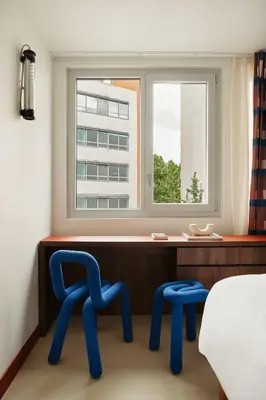 Un ou plusieurs lits dans un hébergement de l'établissement Edgar Suites Montrouge
