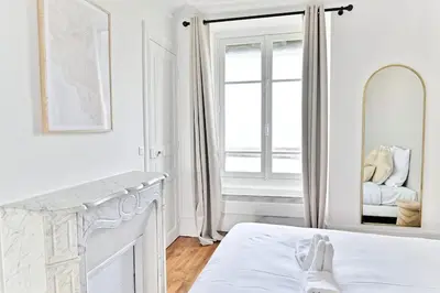 Un ou plusieurs lits dans un hébergement de l'établissement Appartement Vue sur Tour effeil Defense