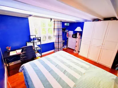 Un ou plusieurs lits dans un hébergement de l'établissement Beautiful quiet family loft Paris