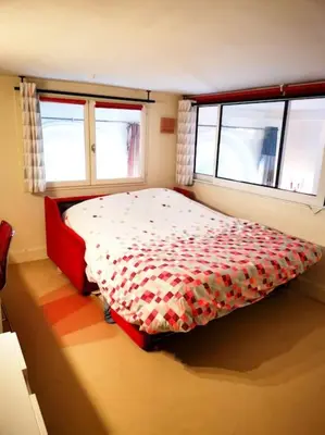 Un ou plusieurs lits dans un hébergement de l'établissement Beautiful quiet family loft Paris