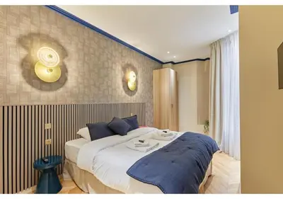 Un ou plusieurs lits dans un hébergement de l'établissement Incredible AC Apartment 3 bedrooms Center of Paris by Studio Prestige