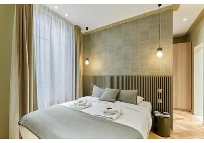 Un ou plusieurs lits dans un hébergement de l'établissement Incredible AC Apartment 3 bedrooms Center of Paris by Studio Prestige