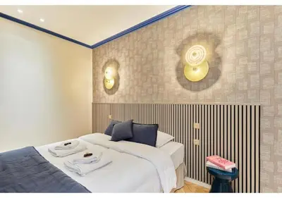 Un ou plusieurs lits dans un hébergement de l'établissement Incredible AC Apartment 3 bedrooms Center of Paris by Studio Prestige