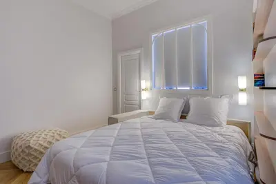 Un ou plusieurs lits dans un hébergement de l'établissement Luxurious Apartment - Champs Elysées - With AC