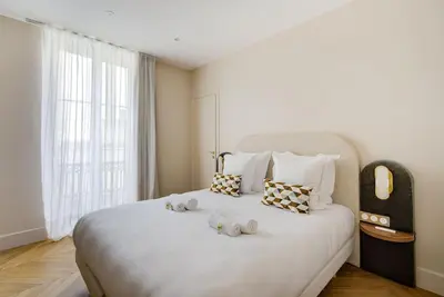 Un ou plusieurs lits dans un hébergement de l'établissement Stunning Family Flat - Grands Boulevards - with AC