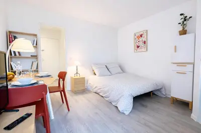 Un ou plusieurs lits dans un hébergement de l'établissement Relax-Parc des expos-Wifi by La clé des expos