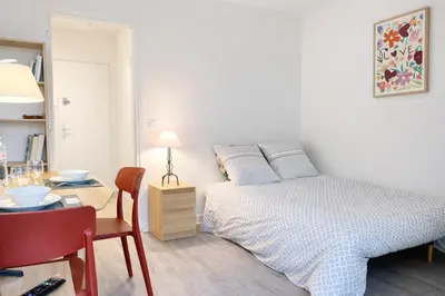 Un ou plusieurs lits dans un hébergement de l'établissement Relax-Parc des expos-Wifi by La clé des expos