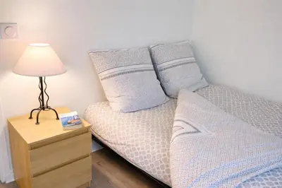 Un ou plusieurs lits dans un hébergement de l'établissement Relax-Parc des expos-Wifi by La clé des expos