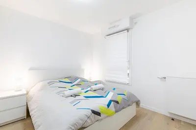 Un ou plusieurs lits dans un hébergement de l'établissement GuestReady - Séjour Moderne à Issy-les-Moulineaux