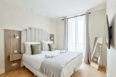 Un ou plusieurs lits dans un hébergement de l'établissement Magnificent Family Flat - Le Marais - with AC