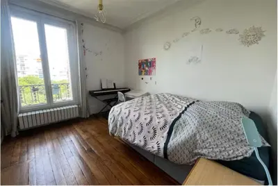Un ou plusieurs lits dans un hébergement de l'établissement Paris park view 5 bedrooms familly subway 6