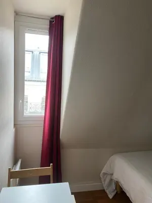 Un ou plusieurs lits dans un hébergement de l'établissement Paris top location