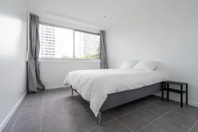 Un ou plusieurs lits dans un hébergement de l'établissement Appartement 2 Chambres - Porte de Choisy