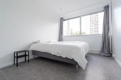 Un ou plusieurs lits dans un hébergement de l'établissement Appartement 2 Chambres - Porte de Choisy