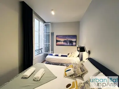 Un ou plusieurs lits dans un hébergement de l'établissement Urban Flat 110 - Luxury 3 Bedroom near Galeries Lafayette