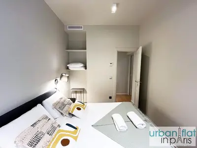 Un ou plusieurs lits dans un hébergement de l'établissement Urban Flat 110 - Luxury 3 Bedroom near Galeries Lafayette