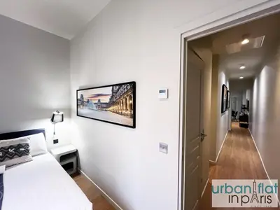 Un ou plusieurs lits dans un hébergement de l'établissement Urban Flat 110 - Luxury 3 Bedroom near Galeries Lafayette
