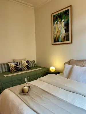 Un ou plusieurs lits dans un hébergement de l'établissement Champs Elysée Prestige Apartment