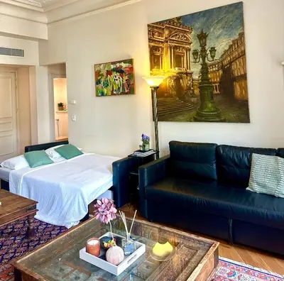 Un ou plusieurs lits dans un hébergement de l'établissement Champs Elysée Prestige Apartment