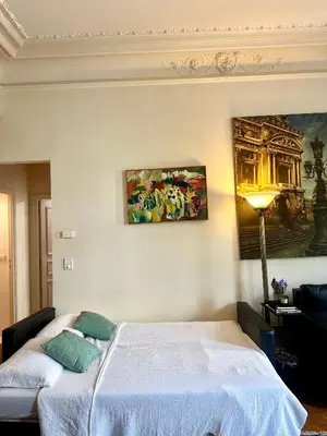 Un ou plusieurs lits dans un hébergement de l'établissement Champs Elysée Prestige Apartment