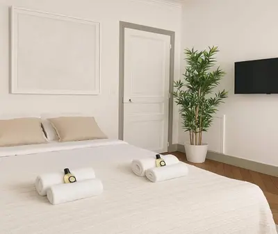 Un ou plusieurs lits dans un hébergement de l'établissement Arc de Triomphe - Premium apartment with lift for 6