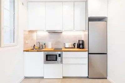 Cuisine ou kitchenette dans l'établissement GuestReady - Charmant 2 pièces lumineux au calme