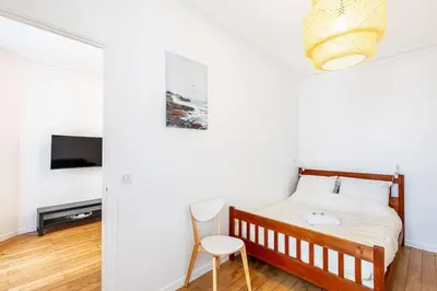 Un ou plusieurs lits dans un hébergement de l'établissement GuestReady - Charmant 2 pièces lumineux au calme