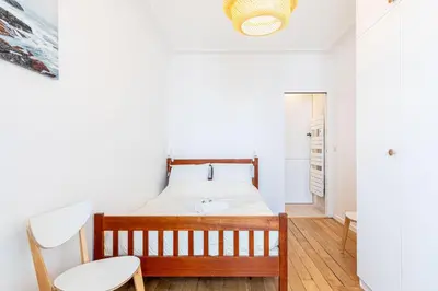 Un ou plusieurs lits dans un hébergement de l'établissement GuestReady - Charmant 2 pièces lumineux au calme