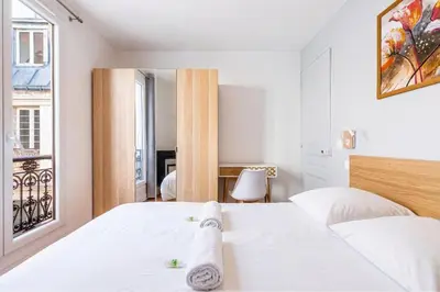 Un ou plusieurs lits dans un hébergement de l'établissement GuestReady - Sérénité au Cœur de Paris